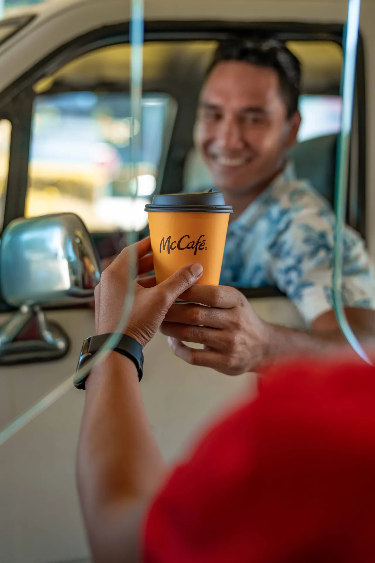 McCafé drink presented from a car