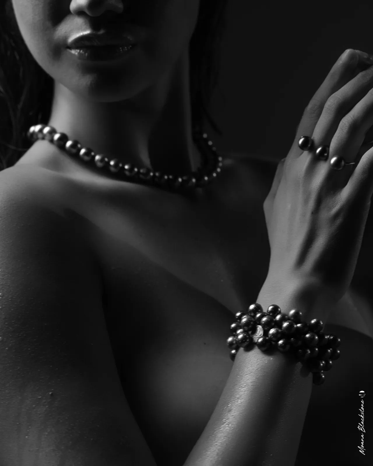 Black-and-white pearl jewellery photograph