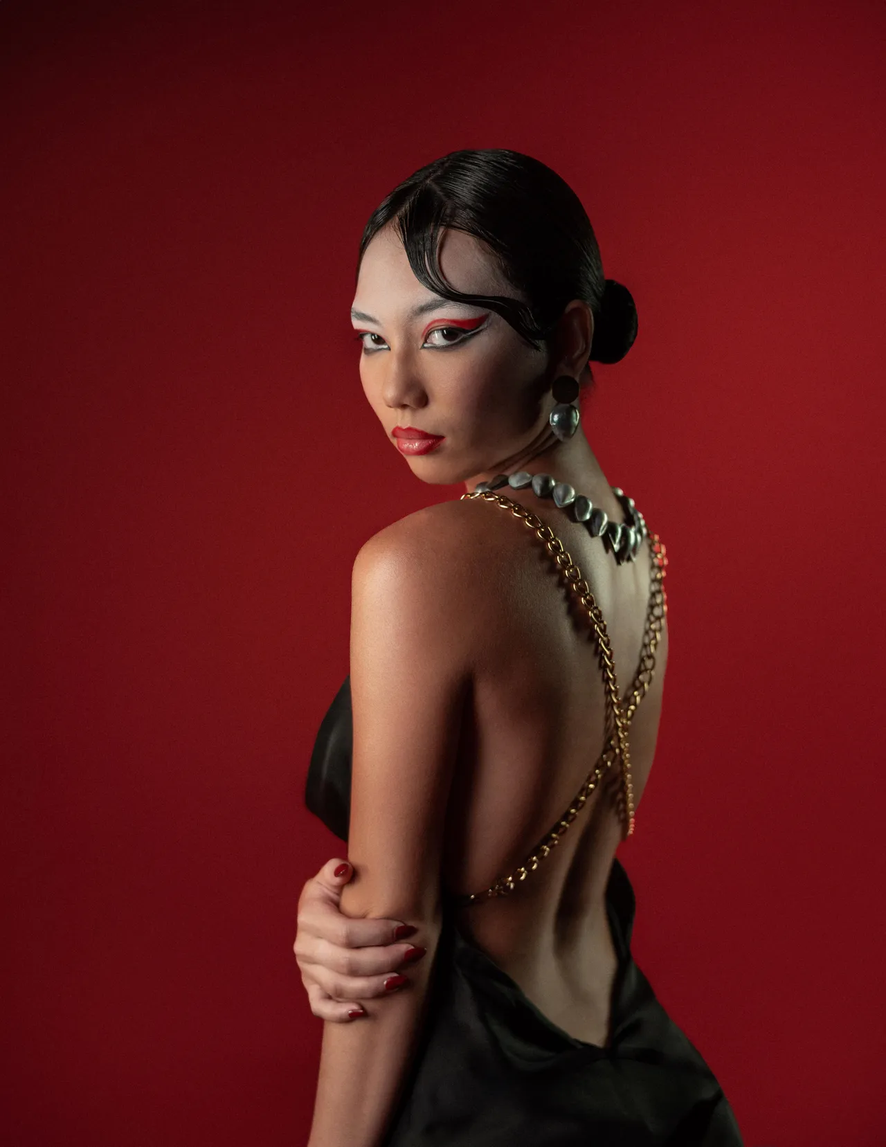 Beauty portrait against a red backdrop