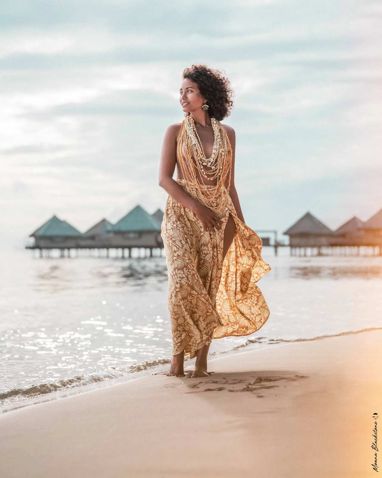 Golden dress beside the lagoon