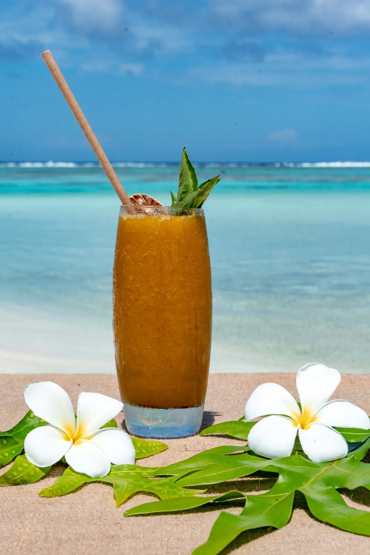 Cocktail with flowers beside the lagoon