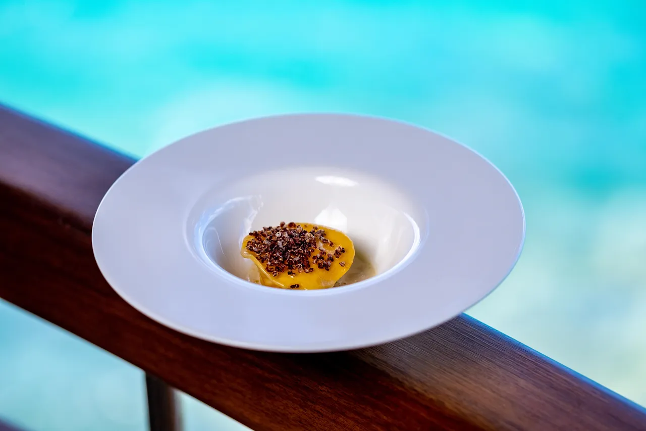 Plated dish beside a swimming pool