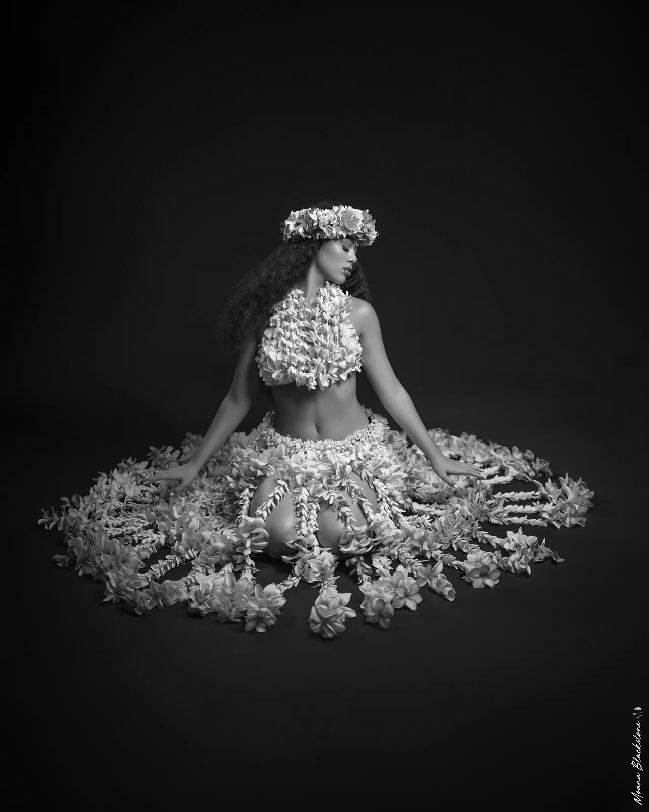 Black-and-white portrait in a floral costume